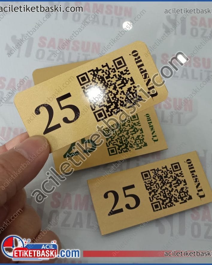 QR etiket, qr masa üzeri masa numarası, menü baskısı, menü etiket baskıları, altın renk metal etiket, gümüş renk metal etiket baskısı, restoran, büfe, kafe için masa numarası baskılı, etiket üretimi, imalat, ebat ve adede güre fiyat alınız QR label, qr table number on the table, menu printing, menu label printing, gold color metal label, silver color metal label printing, restaurant, buffet, cafe table number printing, label production, manufacturing, get a price according to size and quantity